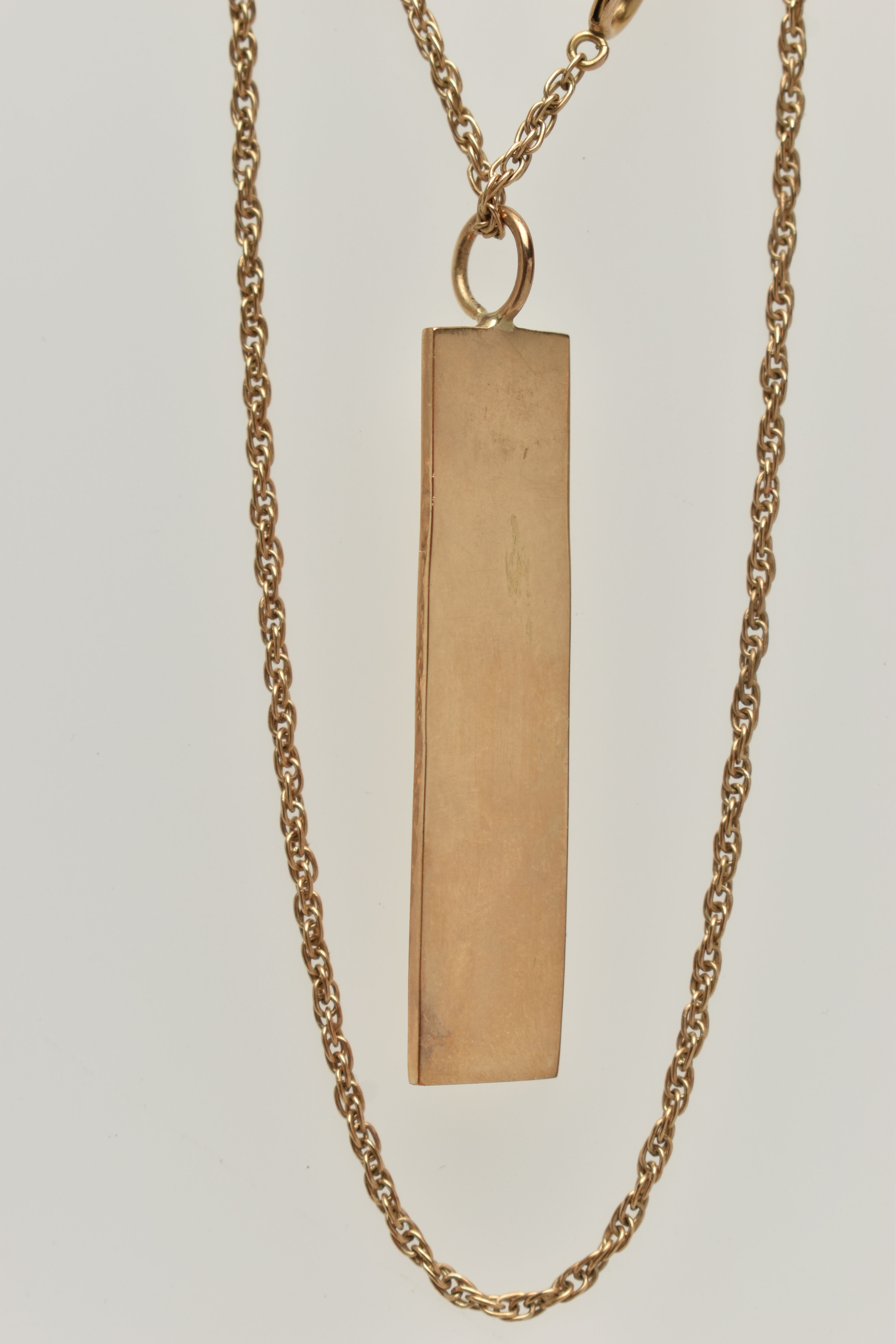 A 9CT GOLD INGOT PENDANT AND CHAIN, rectangular ingot hallmarked 9ct London 1977, fitted with a jump - Image 3 of 3