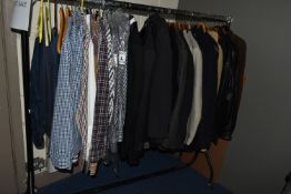 ONE RAIL OF GENTLEMEN'S SUITS, JACKETS AND SHIRTS, to include three well-worn leather jackets, a