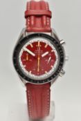 AN OMEGA SPEEDMASTER REDUCED RACING RED MICHAEL SCHUMACHER EDITION WRISTWATCH, red dial with three