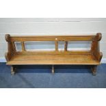 AN EARLY 20TH CENTURY PINE CHURCH PEW, length 192cm (condition report: -surface scratches and wear)