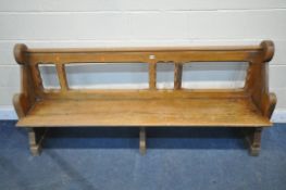 AN EARLY 20TH CENTURY PINE CHURCH PEW, length 192cm (condition report: -surface scratches and wear)