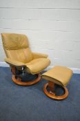 AN EKORNES STRESSLESS TAN LEATHER RECLINING SWIVEL ARMCHAIR, and footstool (condition report: -