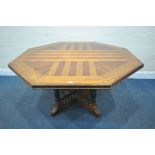 AN EARLY 20TH CENTURY WALNUT OCTAGONAL LIBRARY CENTRE TABLE, in the manner of A.W.N Pugin, the