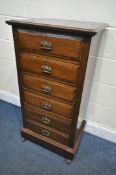 A TALL EARLY 20TH CENTURY OAK CHEST OF SIX DRAWERS, width 56cm x depth 42cm x height 110cm (