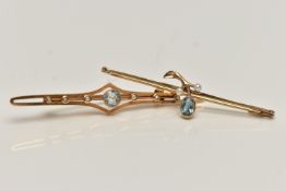 TWO EARLY 20TH CENTURY BROOCHES, the first centring on a circular cut aquamarine, milgrain collet