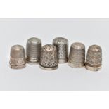 SIX THIMBLES, to include two with full silver hallmarks, approximate gross weight 9.2 grams, two