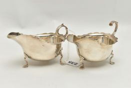 A PAIR OF GEORGE V SILVER SAUCEBOATS, of oval form with wavy rims, S scroll handles, on three