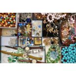 A BOX OF ASSORTED COSTUME JEWELLERY, to include beaded necklaces, rings, earrings, chains, brooches,