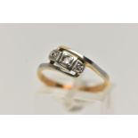 A THREE STONE DIAMOND RING, a central old cut diamond with two additional single cut diamonds, grain