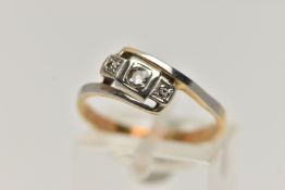 A THREE STONE DIAMOND RING, a central old cut diamond with two additional single cut diamonds, grain