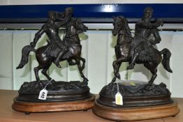 TWO BRONZED SPELTER FIGURES, comprising two knights in armour astride horses, supported by wooden