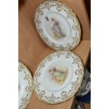 FOUR ROYAL DOULTON CABINET PLATES, printed and tinted with classical figures within a gilt scrolling