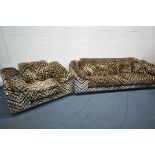 A HOWARD KEITH 1970'S PATTERNED TWO PIECE SUITE, comprising a four seater settee, label to