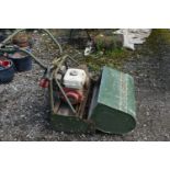 AN ATCO ROYALE B24 PETROL LAWN MOWER, and grass box (condition - engine pulls freely but not