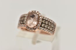 A 14CT GOLD 'LE VIAN' DRESS RING, oval cut morganite, prong set in rose gold with a halo of