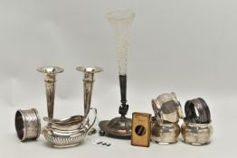 A SMALL PARCEL OF SILVER, comprising a pair of Elizabeth II bud vases, loaded bases, Birmingham