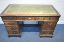 A MAHOGANY PEDESTAL DESK, with a green leather writing surface, and nine drawers, on bracket feet,