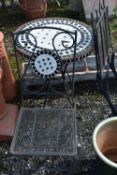 A WROUGHT IRON THREE PIECE BISTRO SET, to include a circular table with mosaic top, 60cm x height
