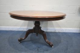 A VICTORIAN MAHOGANY CIRCULAR TIL TOP TRIPOD TABLE, on a turned plinth, scrolled legs, with two