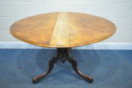 A VICTORIAN BURR WALNUT OVAL SUTHERLAND TABLE, on four scrolled legs and brass casters, open