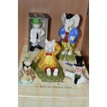 A GROUP OF CERAMIC FIGURES, comprising two boxed Royal Doulton Rupert Bear figures: Pretending to be