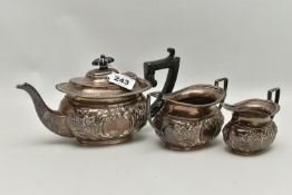 A LATE VICTORIAN SILVER THREE PIECE BACHELOR'S TE SET OF OVAL FORM, gadrooned rims, foliate repoussé