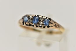 A YELLOW METAL GEM SET RING, three oval cut blue topaz and four old cut diamonds prong set in yellow