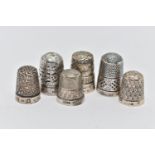 SIX THIMBLES, to include four with full silver hallmarks, approximate gross weight 18.4 grams, one