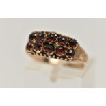 A LATE VICTORIAN 9CT GOLD GARNET RING, designed with two rows of five rose cut garnets, to a