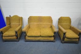 AN EARLY TO MID 20TH CENTURY OAK THREE PIECE LOUGE SUITE, comprising a two seater settee, length