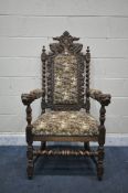 AN EARLY 20TH CENTURY CARVED OAK CAROLEAN ARMCHAIR, the top with twin mythical creatures, barley