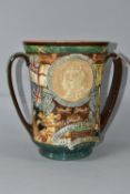 A ROYAL DOULTON LARGE KING GEORGE VI CORONATION LOVING CUP, with twin handles and relief moulded