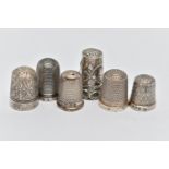 SIX THIMBLES, to include four with full silver hallmarks, approximate gross weight 12.8 grams, one