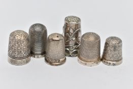 SIX THIMBLES, to include four with full silver hallmarks, approximate gross weight 12.8 grams, one