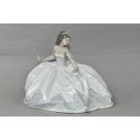 A LLADRO 'AT THE BALL' FIGURINE, no 5859, depicting a seated lady in a ball gown holding a fan,