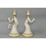 A PAIR OF ROYAL WORCESTER PORCELAIN CANDLESTICKS, in the form of twisted animal horns, each