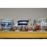 A GROUP OF EIGHT ORIENTAL STYLE PLANTERS AND BOWLS, comprising a large blue and white planter