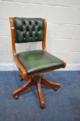 A MAHOGANY GREEN BUTTONED LEATHER SWIVEL OFFICE CHAIR (condition report: -frame worn in places,