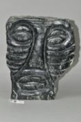 A CARVED AFRICAN GREEN GRANITE STYLISED MALE FACE, polished to the front, the sides and back left