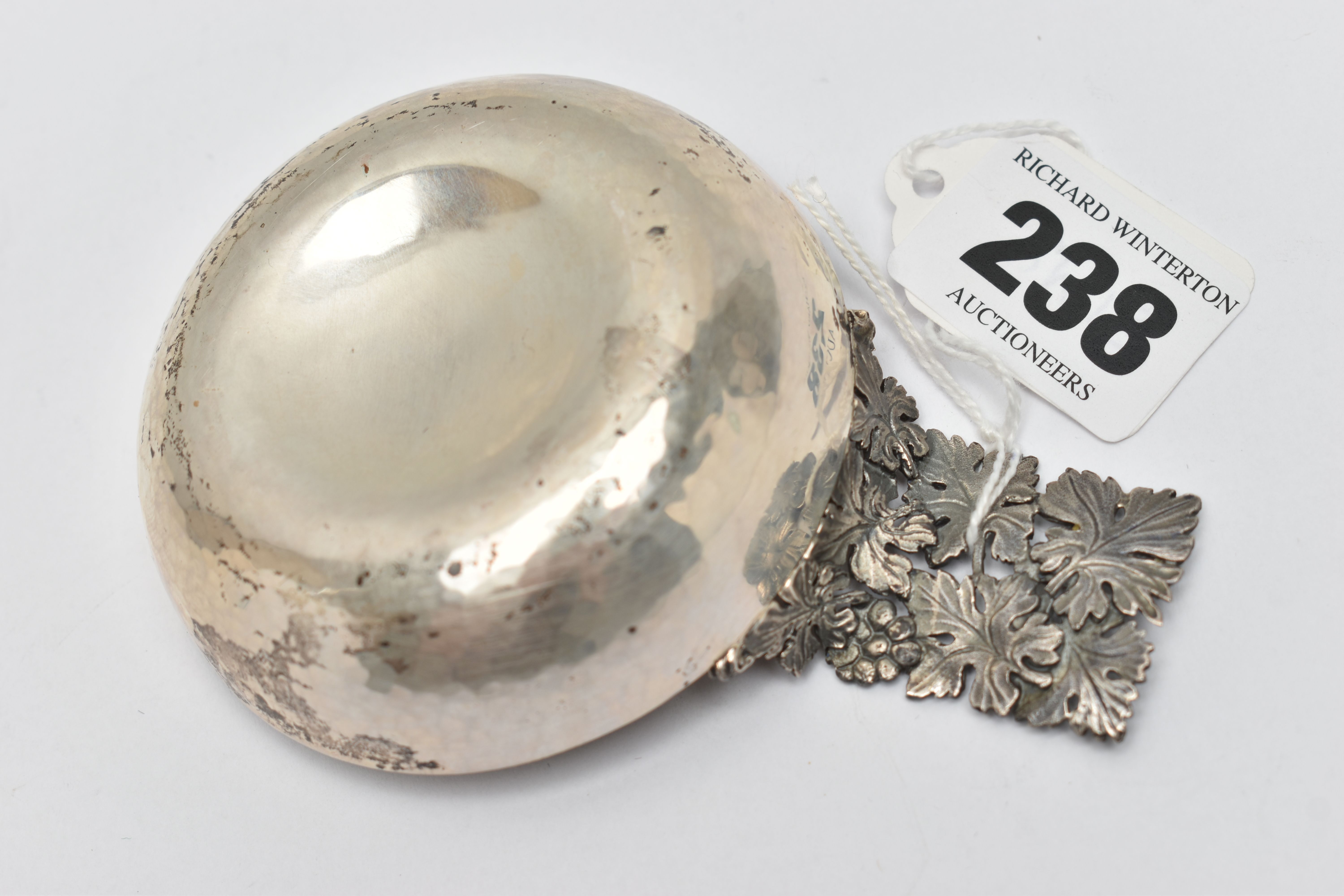 AN ELIZABETH II HECTOR MILLER SILVER WINE TASTER, planished bowl with cast and pierced fruiting vine - Image 3 of 3