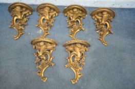 A SET OF SIX GILT ROCOCO WALL SHELVES (condition report: - one shelf with chip to edge) (6)