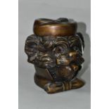 A BRONZE TOBACCO JAR IN THE FORM OF AN ANTHROPOMORPHIC TERRIER, with glass eyes, its hinged cover in