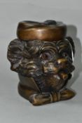 A BRONZE TOBACCO JAR IN THE FORM OF AN ANTHROPOMORPHIC TERRIER, with glass eyes, its hinged cover in