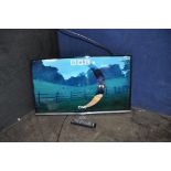 A SAMSUNG UE32H5000AK 32in TV with remote (PAT pass and working) no stand and an incomplete wall