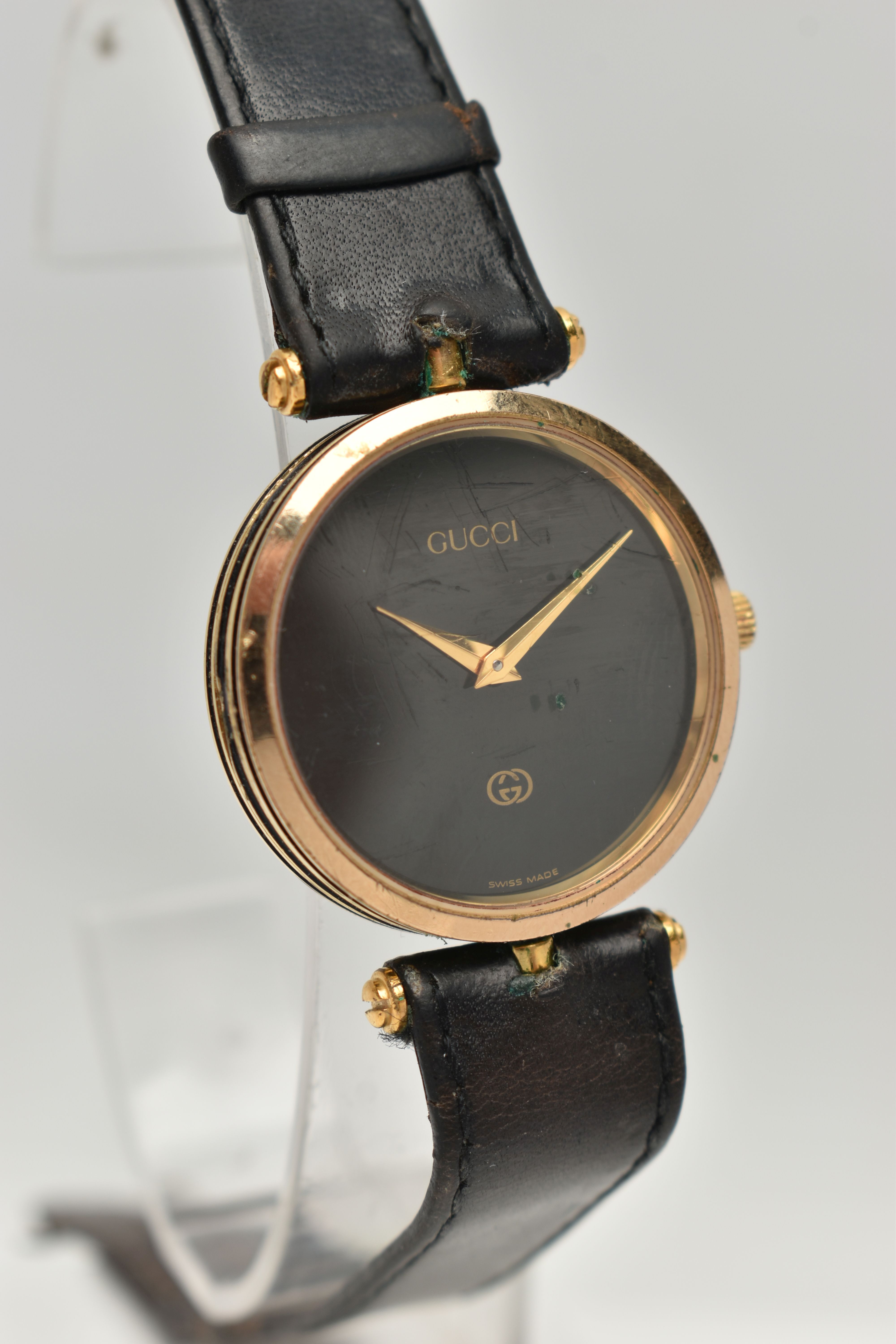 A VINTAGE LADYS GOLD PLATED QUARTZ GUCCI WRISTWATCH, round black dial signed Gucci, case width - Image 2 of 6