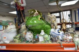 A LARGE QUANTITY OF FROG THEMED CERAMICS AND ORNAMENTS, comprising a pair of metal candle holders,