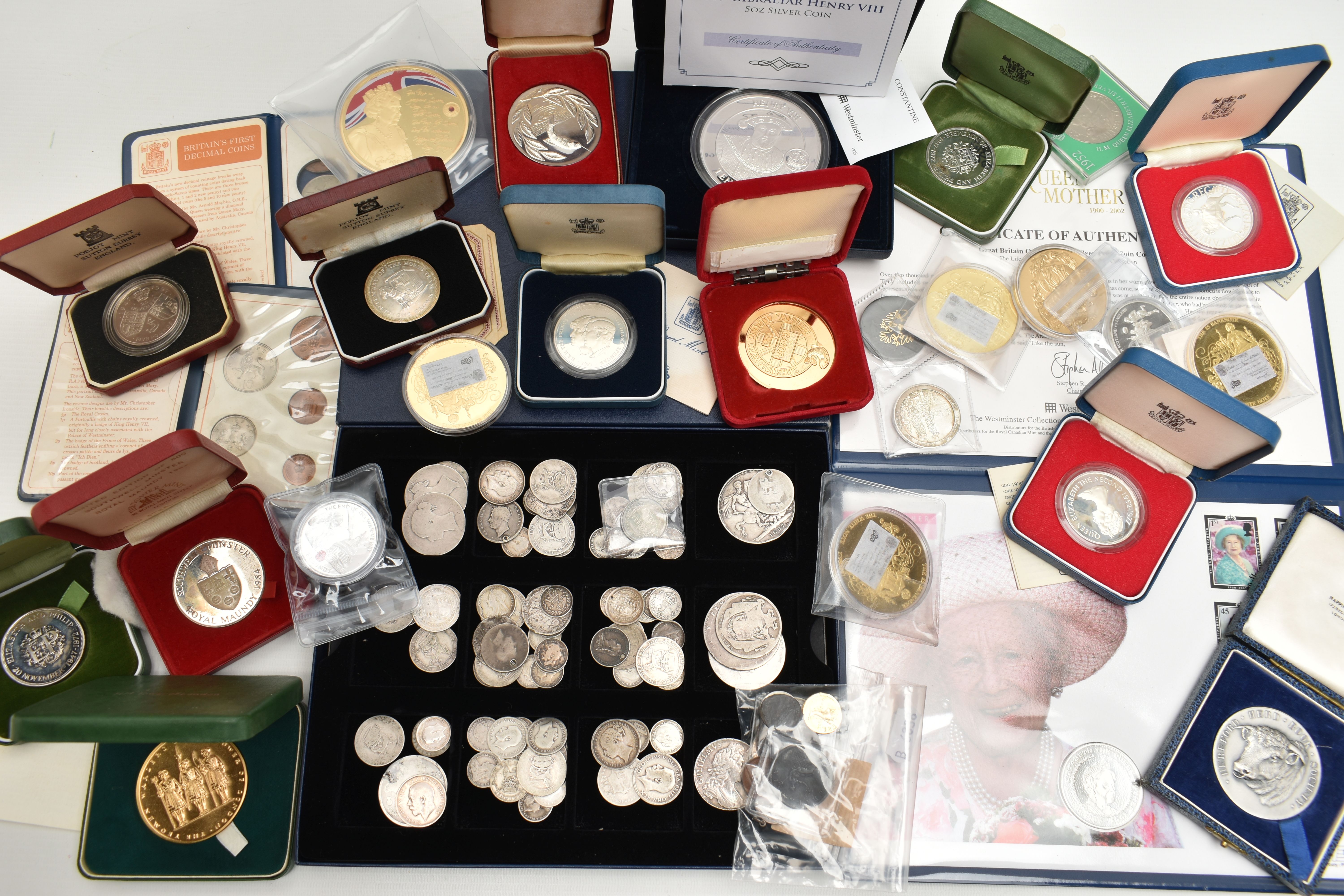 A CARDBOARD BOX CONTAINING MAINLY UK BOXED AND LOOSE SILVER COINAGE, to include a 2009 Gibraltar