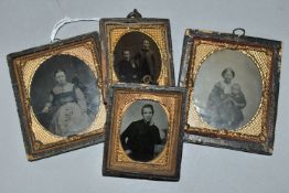 FOUR VICTORIAN AMBROTYPE PORTRAITS, comprising mother and child, two boys, and single sitters of a