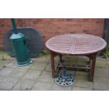 A LARGE CIRCULAR WOODEN EXTENDING GARDEN TABLE, diameter 130cm x height 75cm, an incomplete