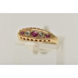 AN EARLY 20TH CENTURY RUBY AND DIAMOND, 18CT GOLD BOAT RING, set with three circular cut rubies,